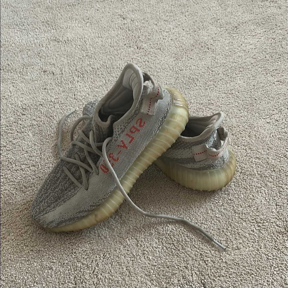 Yeezy Gray and Red Sneakers with Primeknit and Boost Cushioning